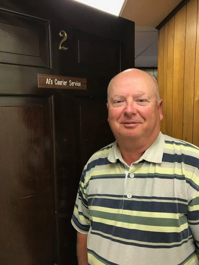 Al, owner of Al's Courier Service, at the office